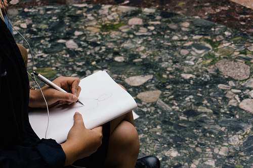 new york person sitting while writing human